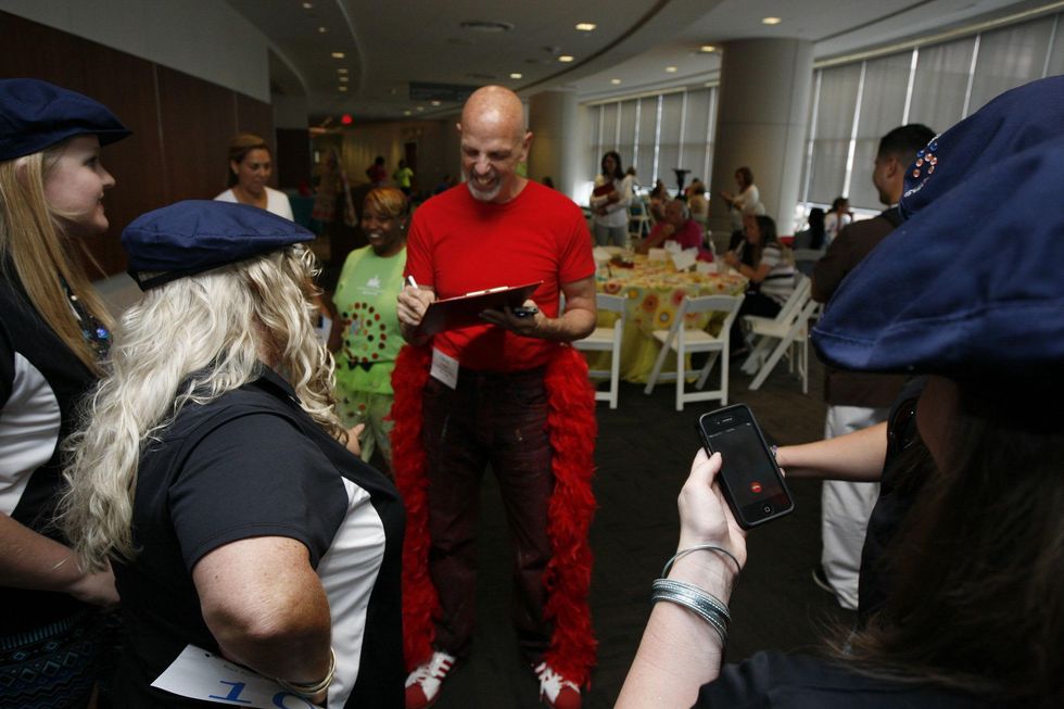 CultureMap's Clifford Pugh judges the Bad Pants Open kick-off party at Texas Children's Hospital