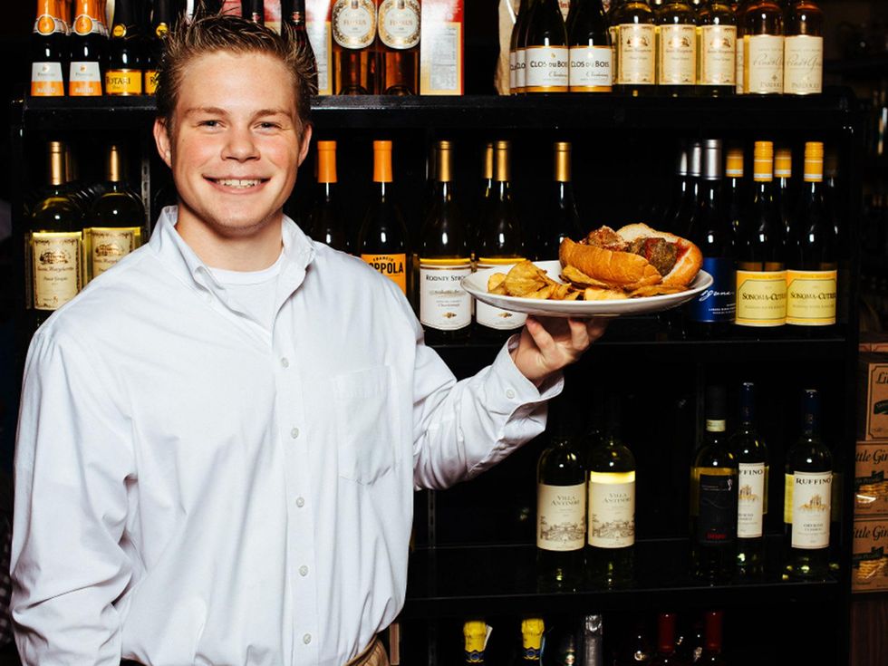 D'Amicos in Katy October 2013 A waiter holds a meatball sandwich