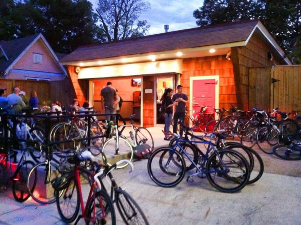 D&T Drive Inn front exterior at night with bicycles