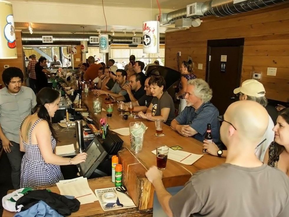 D&T Drive Inn interior with crowd at bar