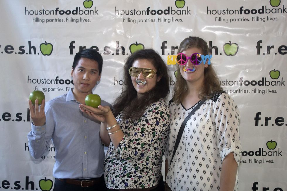 Dan Quach from left, Katherine Johnson, and Sarah Sliffe at the f.r.e.s.h. new young professionals group party june 2014.