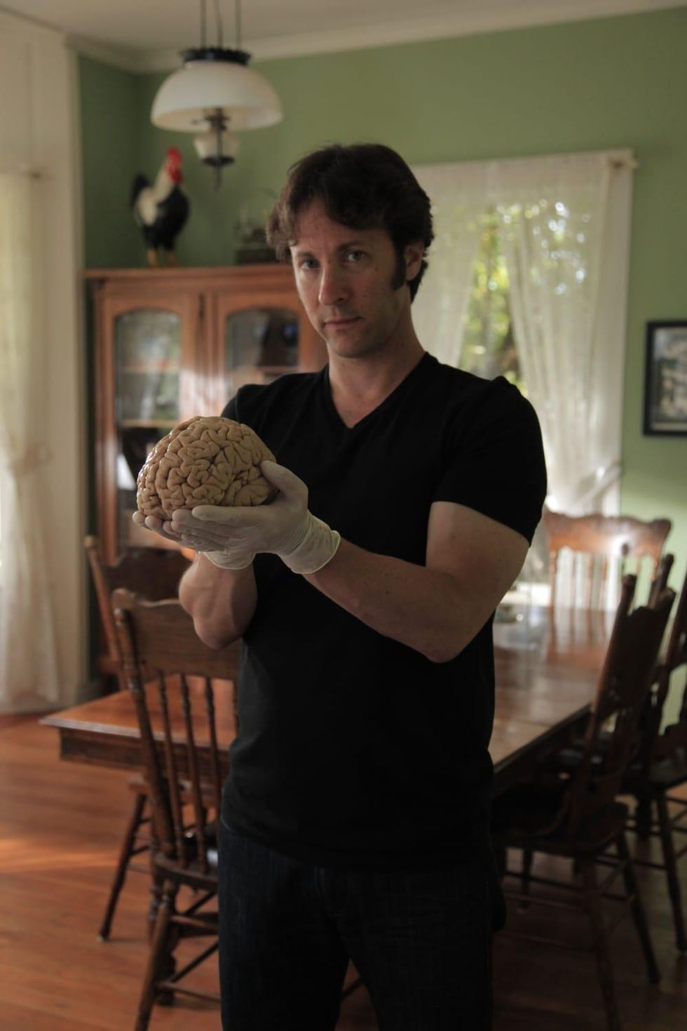 David Eagleman holding a human brain, donated to The M.I.N.D. Institute, University of California at Davis Medical Center for science research