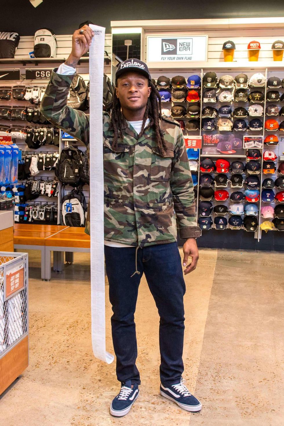 DeAndre Hopkins with bill from shopping spree for kids