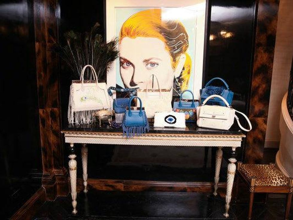 Dee Ocleppo handbags in front of Grace Kelly portrait at Plaza apartment
