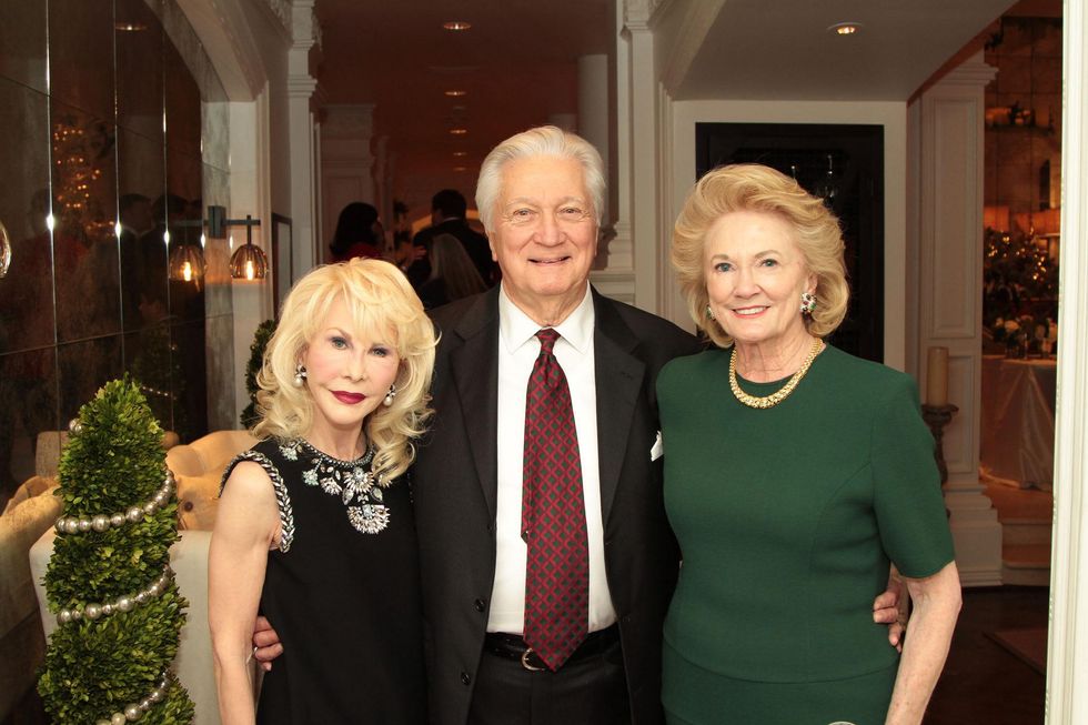 Diane Lokey Farb, left, with Greg and Patsy Fourticq at the 9th Annual Santa's Elves Event December 2014