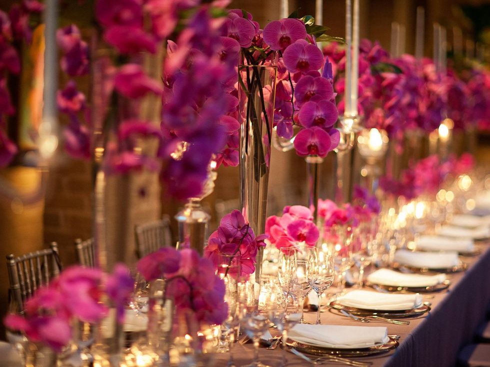 dinner table with flower arrangements, place settings at the Asprey dinner October 2013