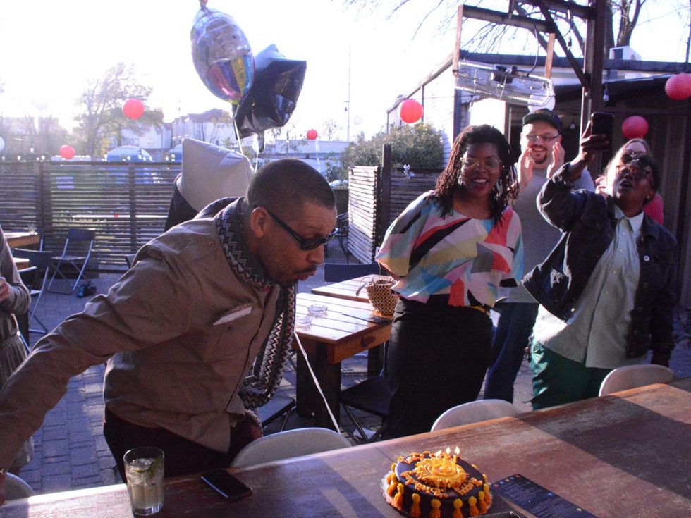 DJ Sun blows out the candles on his birthday cake at The Flat January 2014