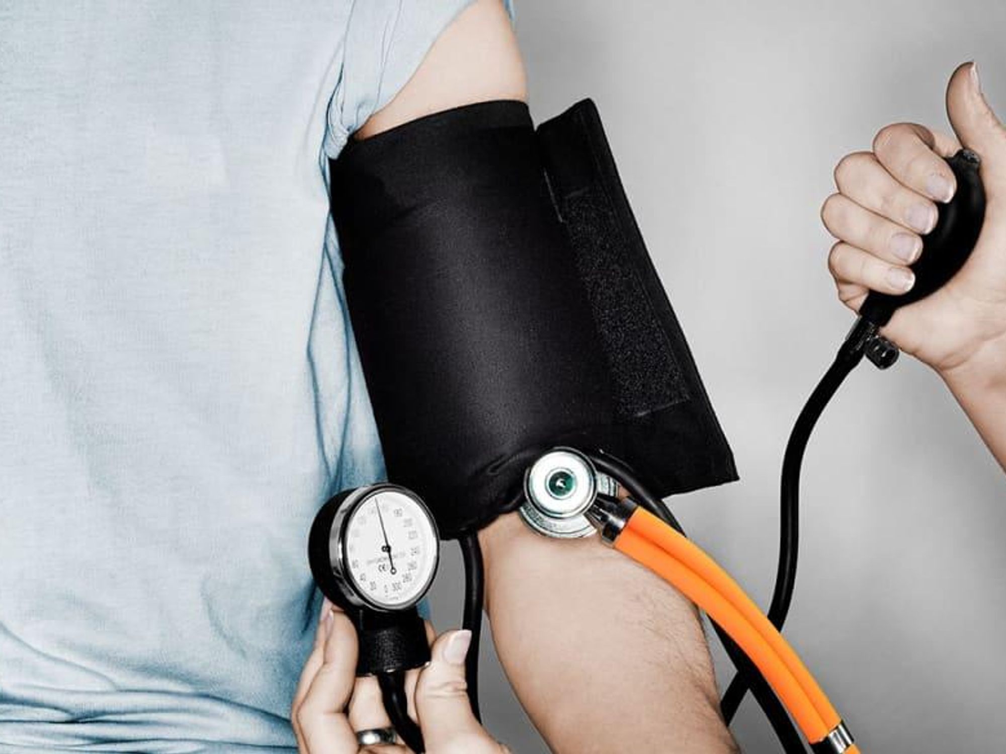 Doctor checking patient's blood pressure