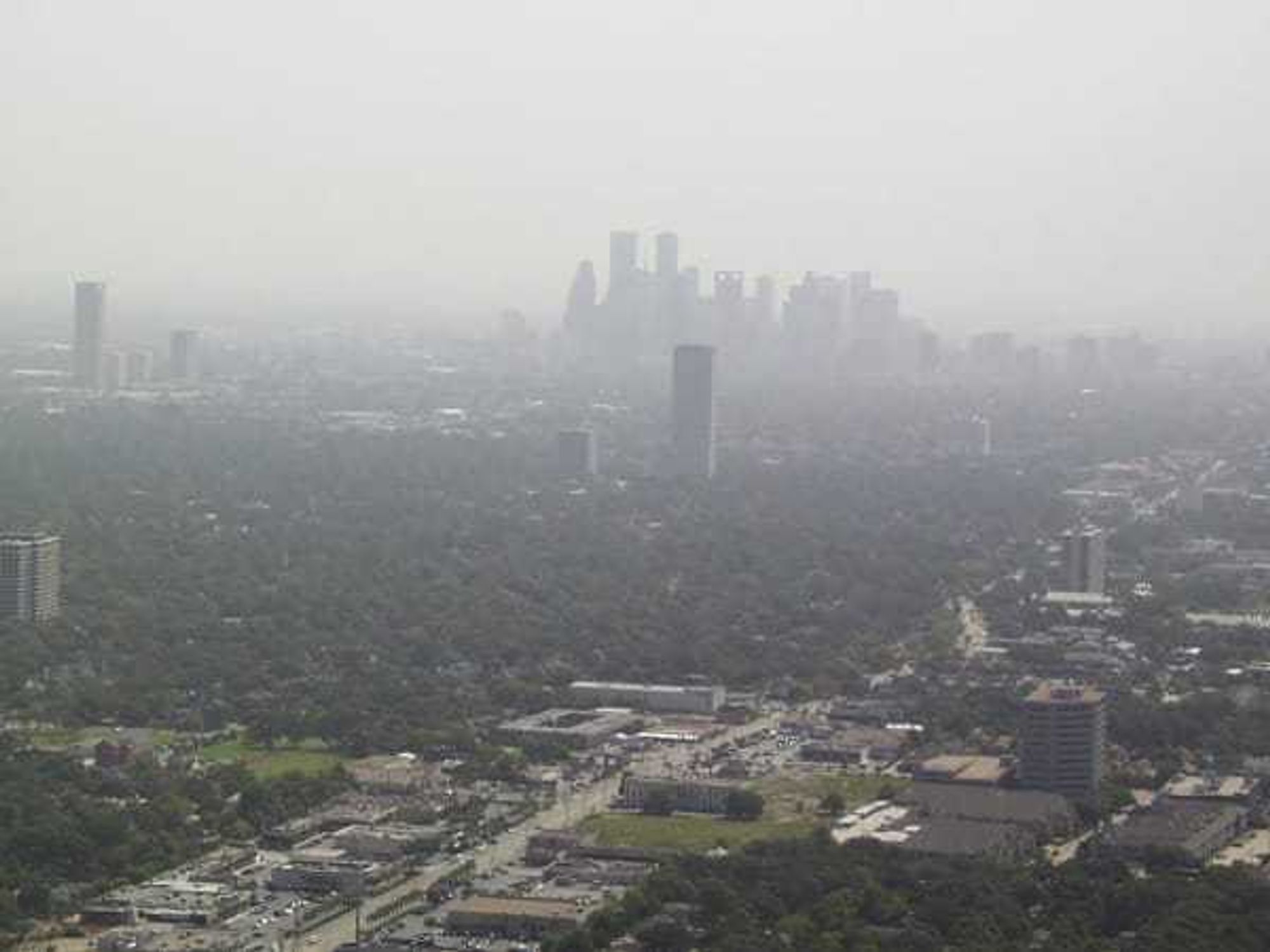 downtown Houston skyline smog haze pollution