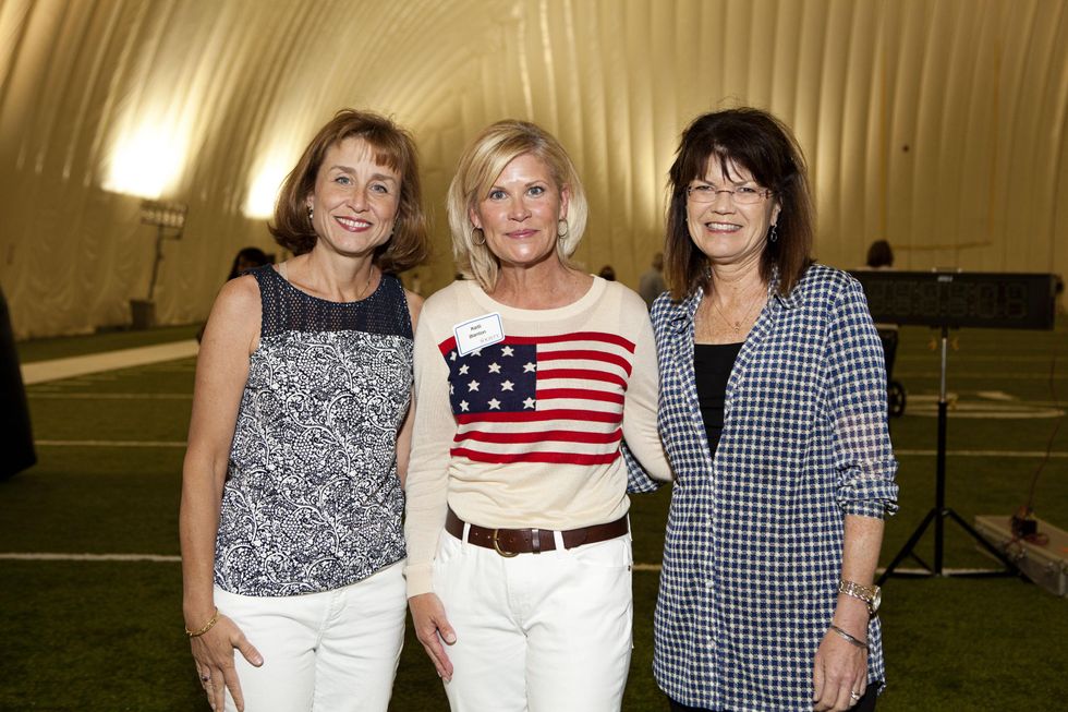 Dr. Julie Boom, from left, Kelli Blanton and Susan Coulter at The Society for Leading Medicine Houston Texans Family Field Day May 2014.