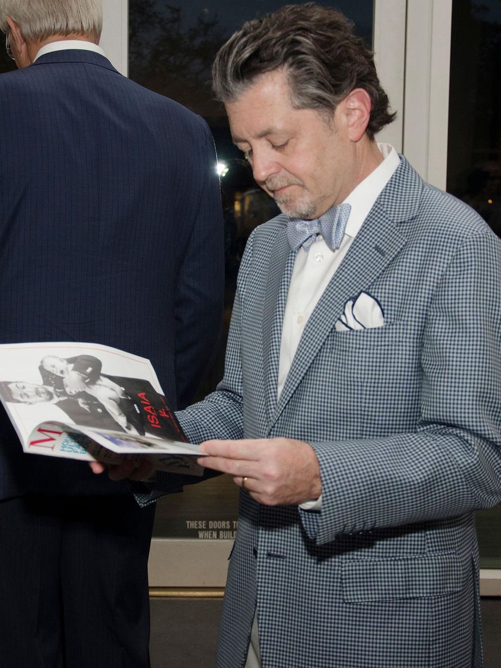 Dr. Stuart Weil reading magazine