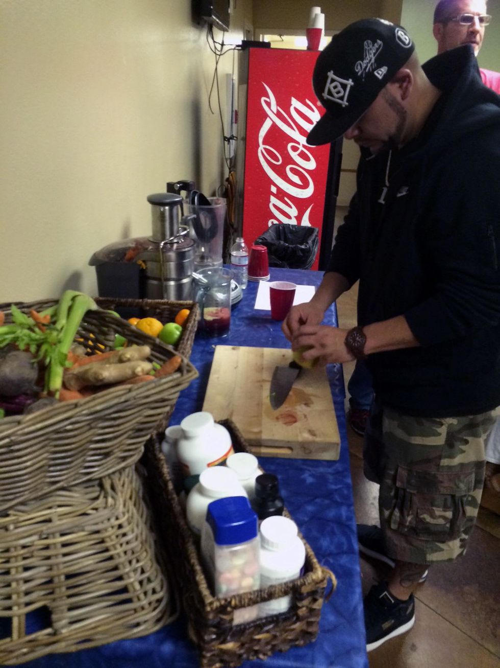 Drake and Lil Wayne concert September 2014 One of drake's entourage members assistants makes him a juice from carrots, beets, ginger