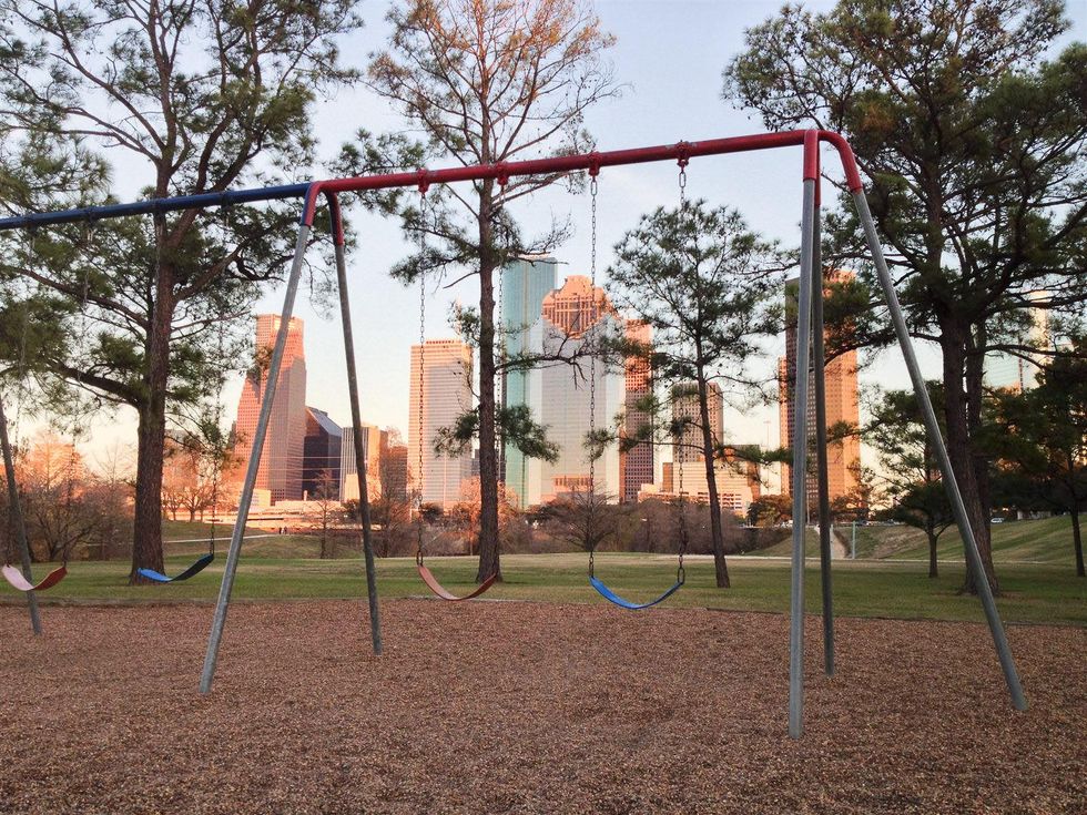 Eleanor Tinsley Park swingset downtown skyline Houston