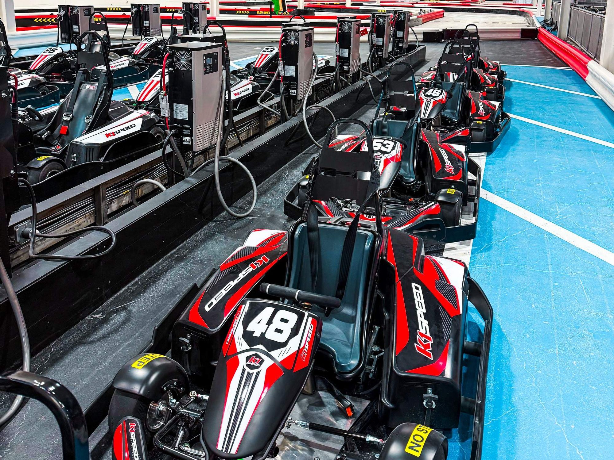 Electric go-karts lined up at the K1 Speed facility in The Woodlands