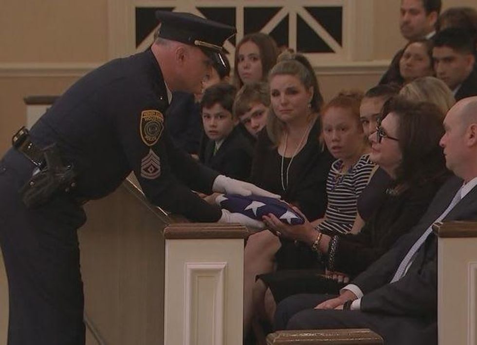 Elyse Lanier recieves flag at funeral of Bob Lanier