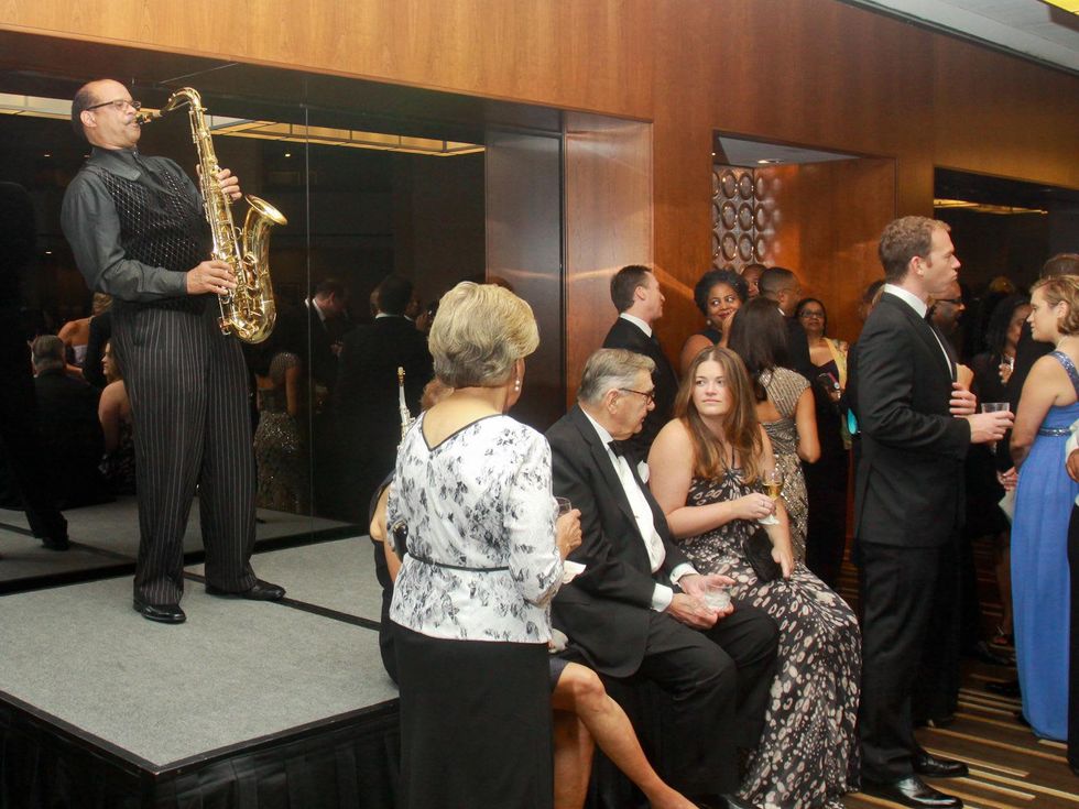 Ensemble Theater gala August 2013 Grady Gaines Jr. playing saxophone