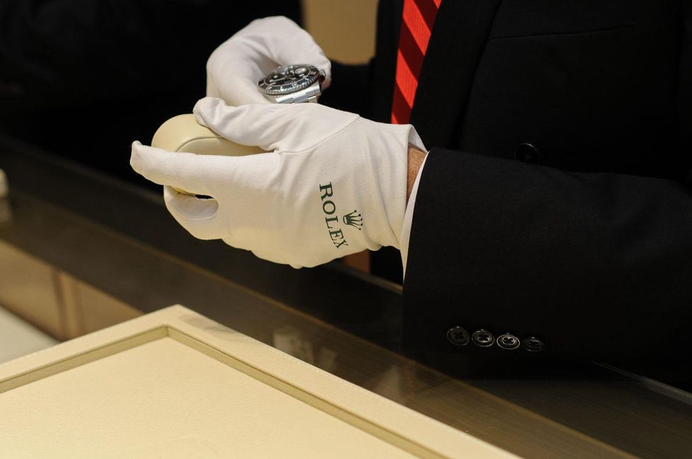 Essee Emdad showing a Rolex Submariner at the Thomas Markle Jewelers grand opening at Gateway Memorial City December 2014