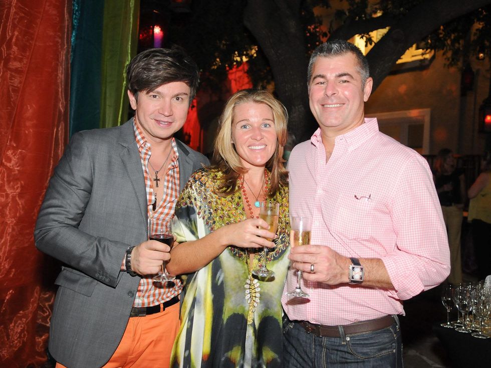 Evgeny Krasilnikov, left, with Kate and Chris Hutson at the Q The Salon Moroccan theme party September 2013