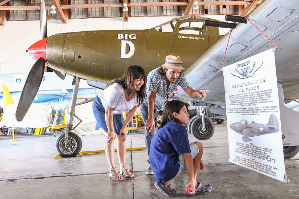 Family looking at plane