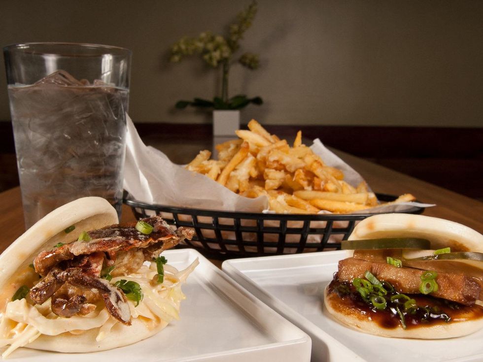 Fat Bao Crab Daddy Bao, pork belly bao and french fries fried potatoes topped with parmesan and rosemary