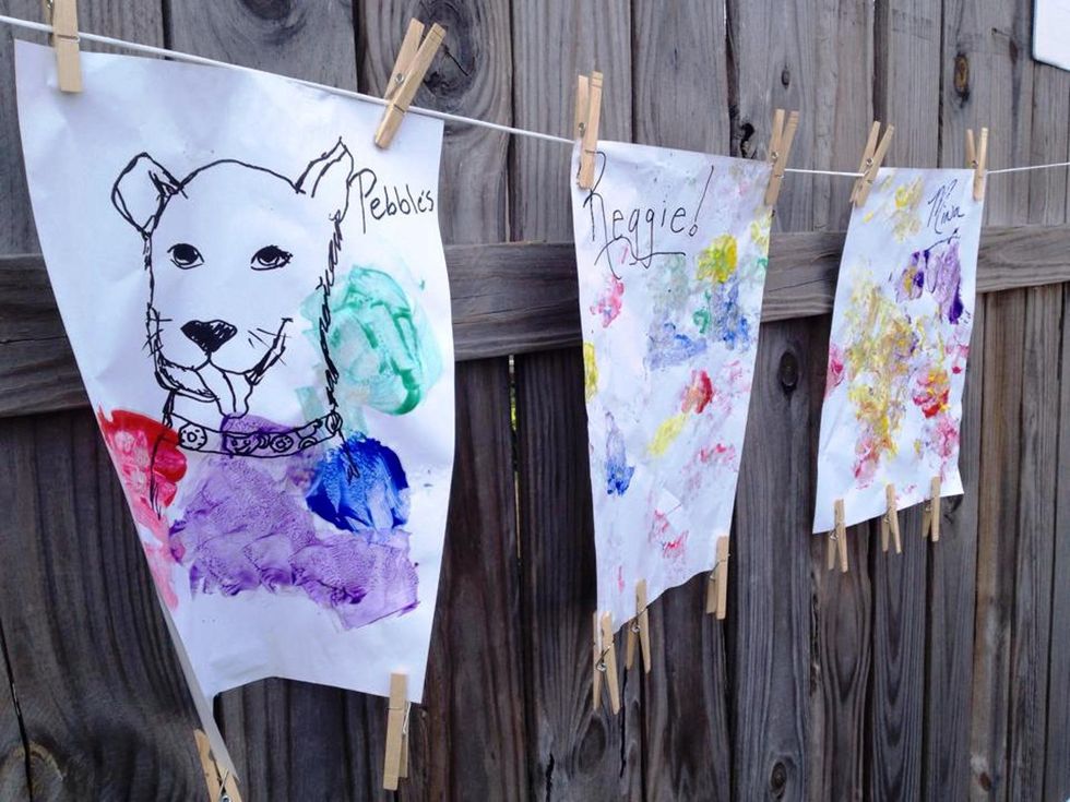 Dogs paint pictures with their paws — and no one can get enough of the