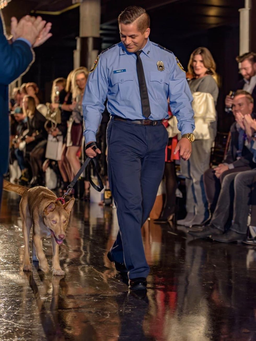 First responder and pet at Salute Houston fashion show