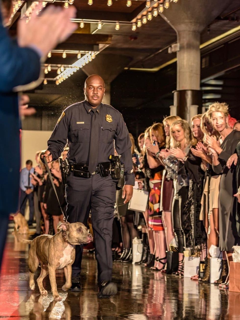 First responder and pet at Salute Houston fashion show