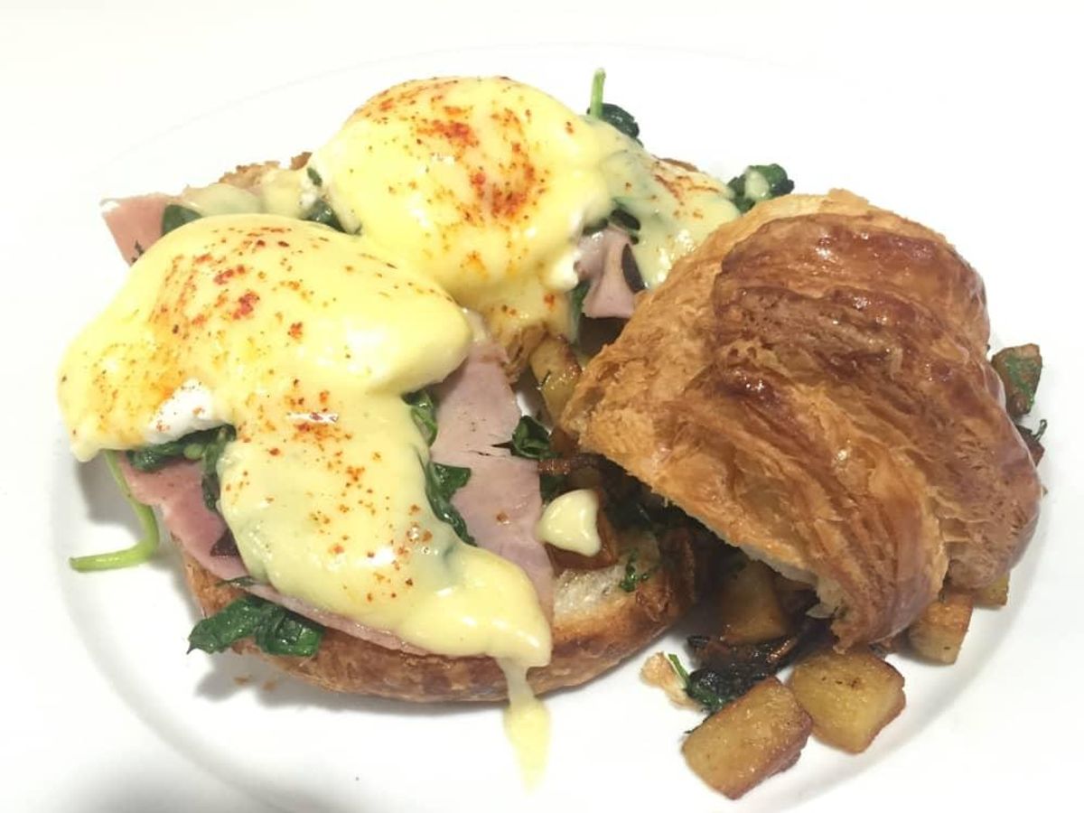 Eggs Benedict on croissant. CultureMap Houston
