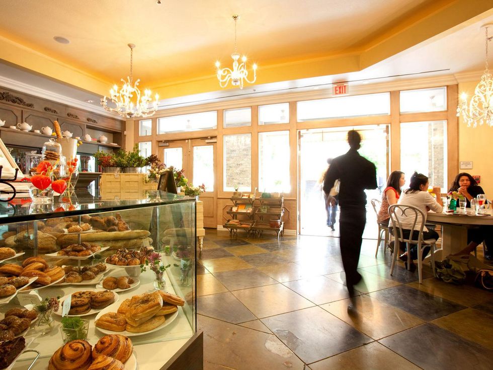 Flora & Muse with waitress walking