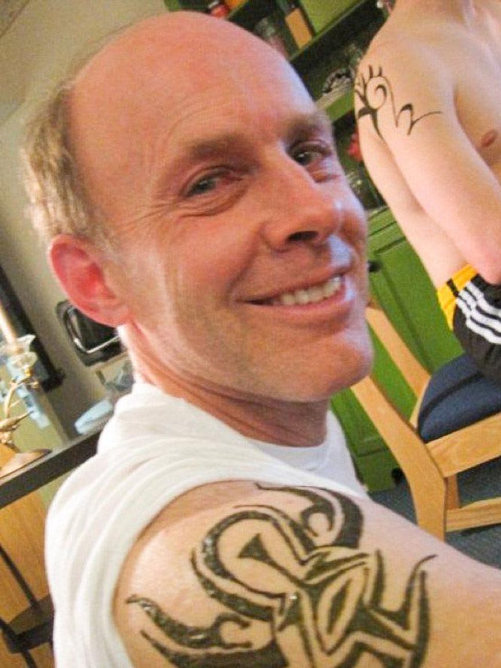 Fort Dodge, Iowa, dentist Dr. James Knight showing tattoo