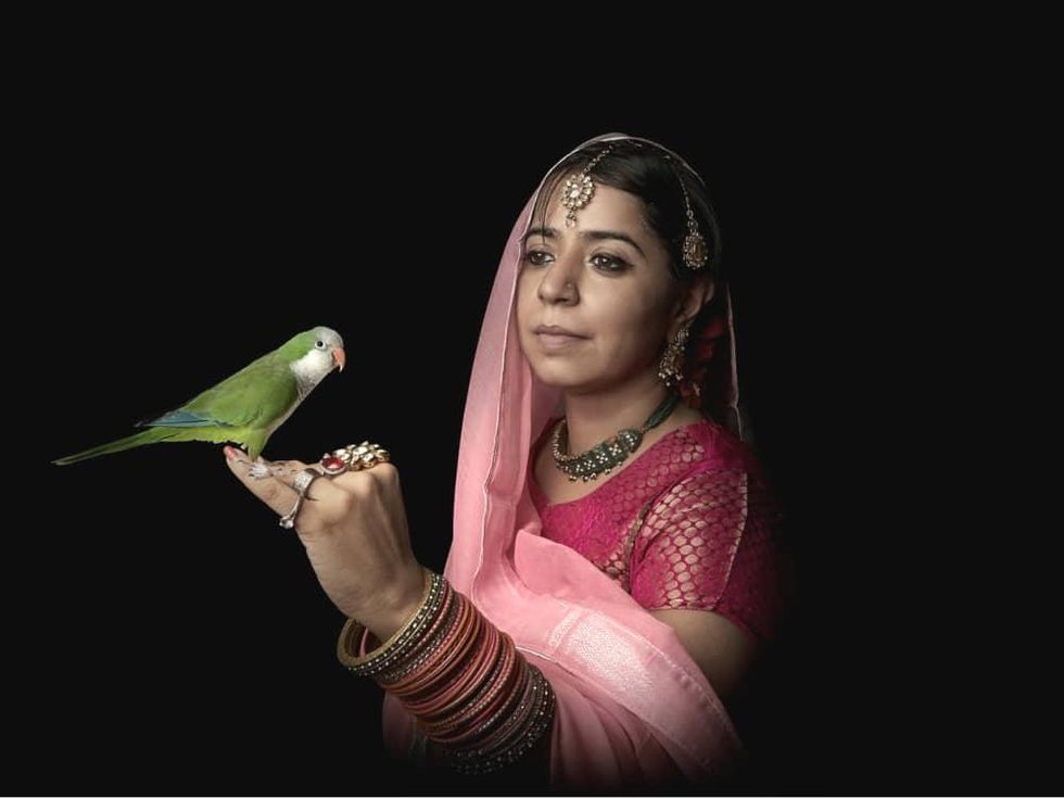 Fotofest women in sari with parrot