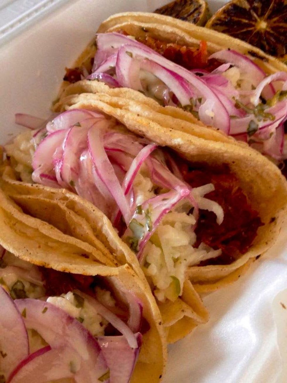 Gastro Punk food truck Houston smoked pork belly tacos, apple jicama slaw, red onion, spicy cilantro lime vinaigrette
