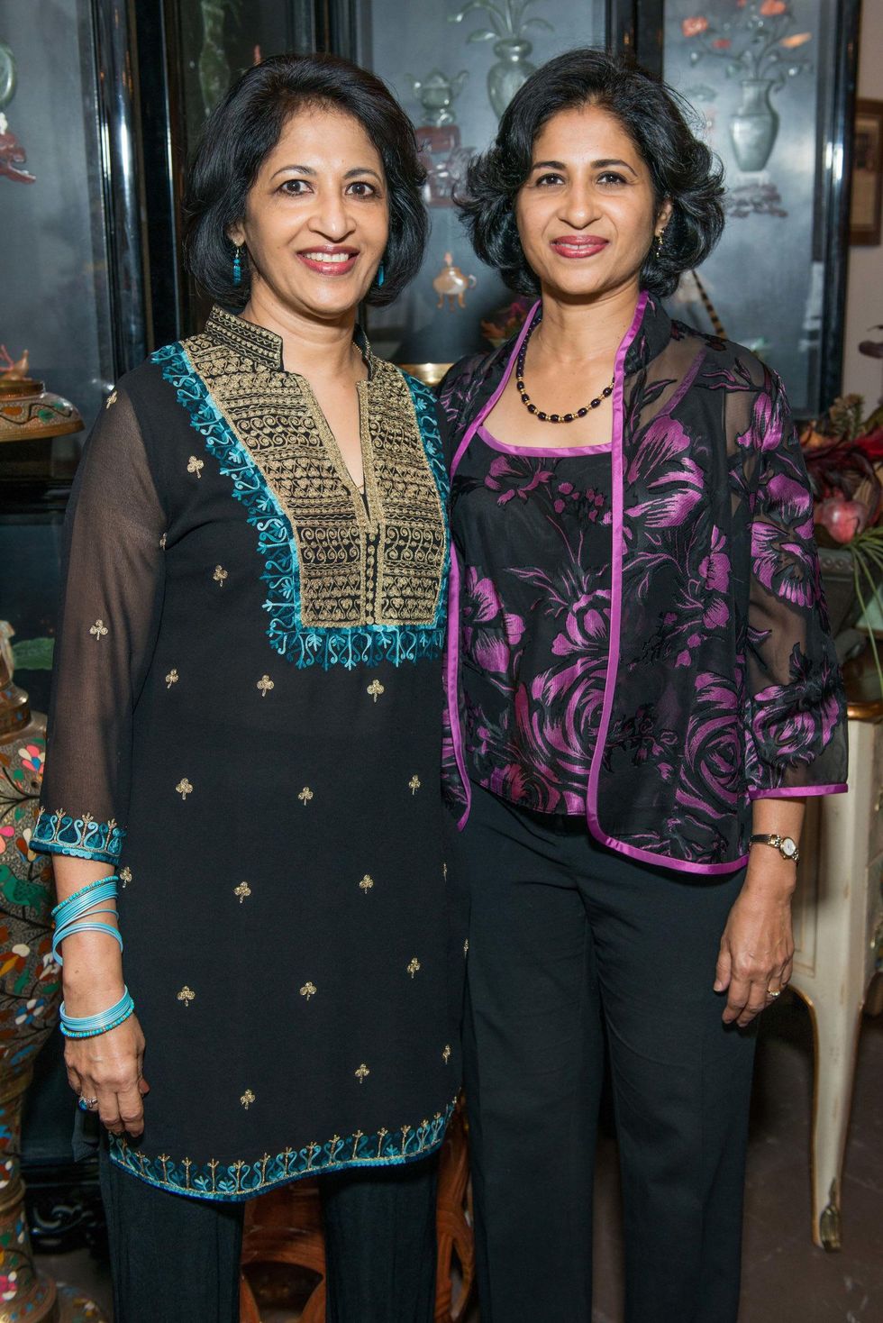 Geetha Mammen, left, and Sueha Kuruvilla at the Abraham's Oriental Rug dinner September 2014