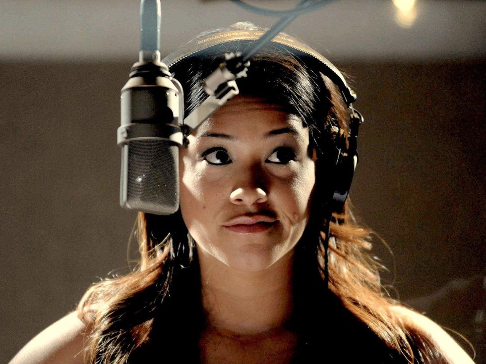 Gina Rodriguez at mic in Filly Brown movie