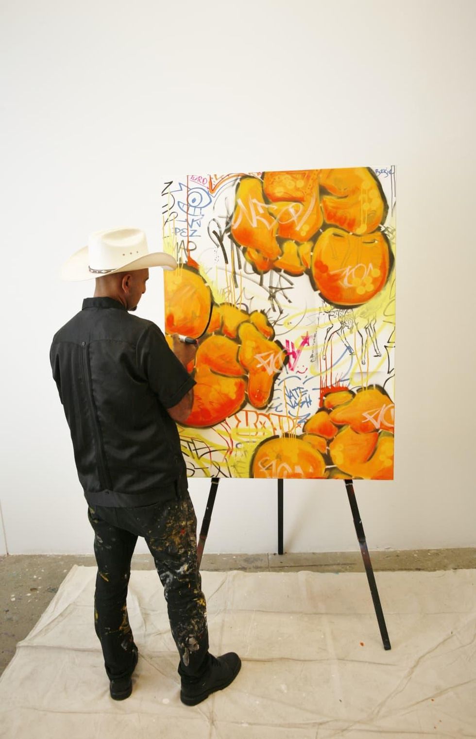 GONZO247 creates a special piece of work live for attendees using his signature style at the Art on the Avenue Preview party.