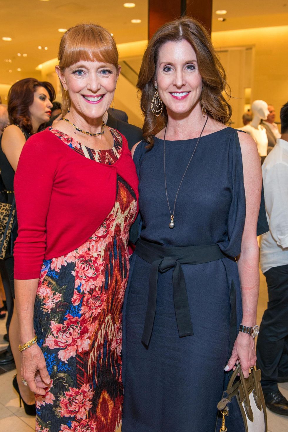 Gracie Cavnar, left, and Phoebe Tudor at the Women of Distinction announcement party October 2014