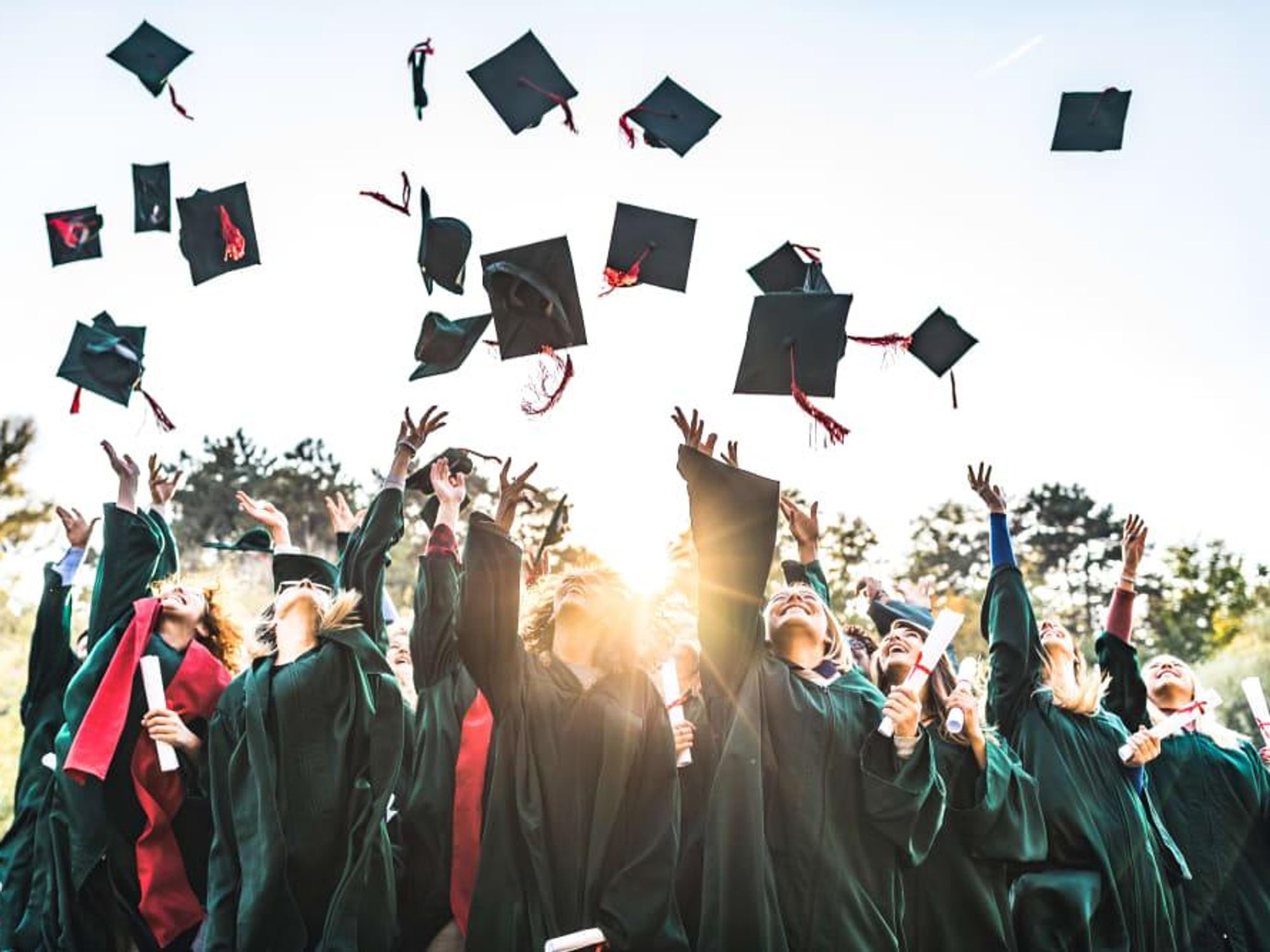 Graduates tossing their caps