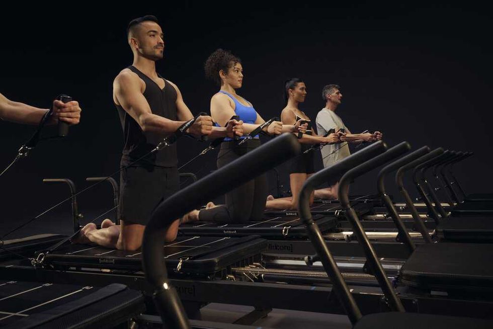Group of people on Solidcore Pilates machines