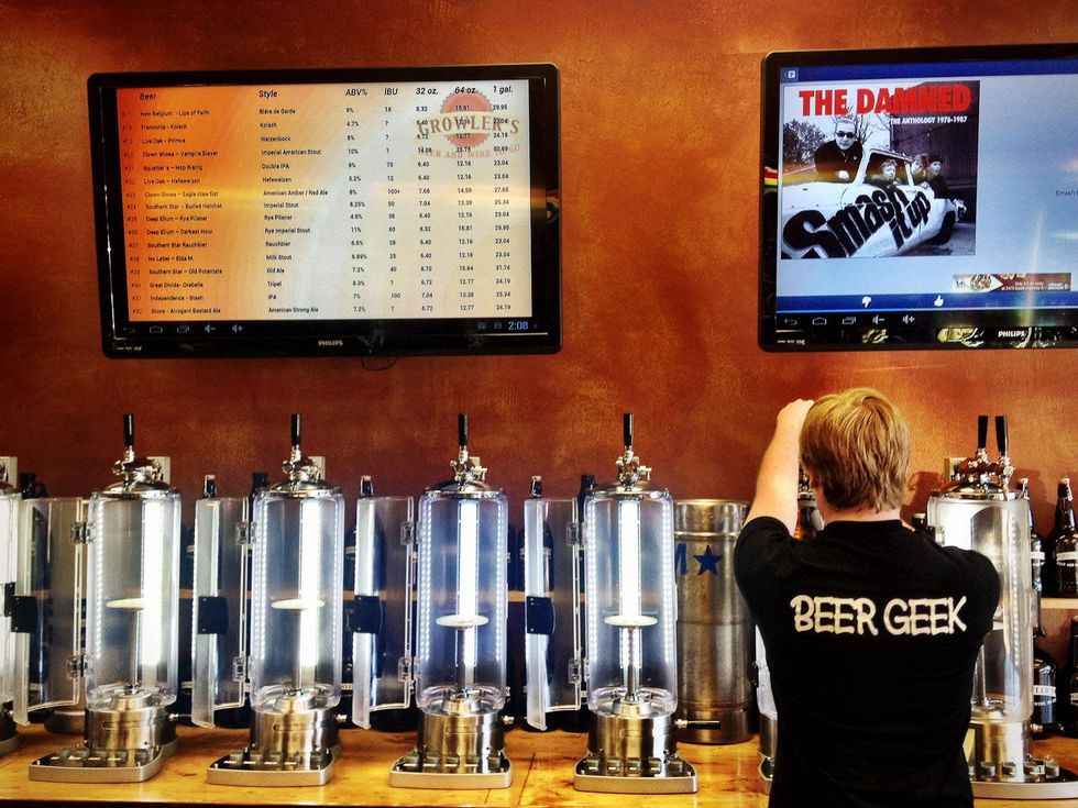 growlers, beer, April 2013, A "beer geek" and tap consultant fills a growler