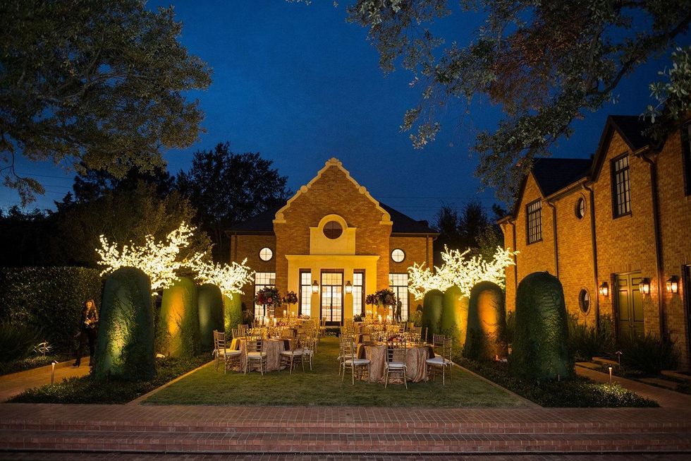 Guests enjoy dinner in the garden at the Alley Artist Dinner November 2014