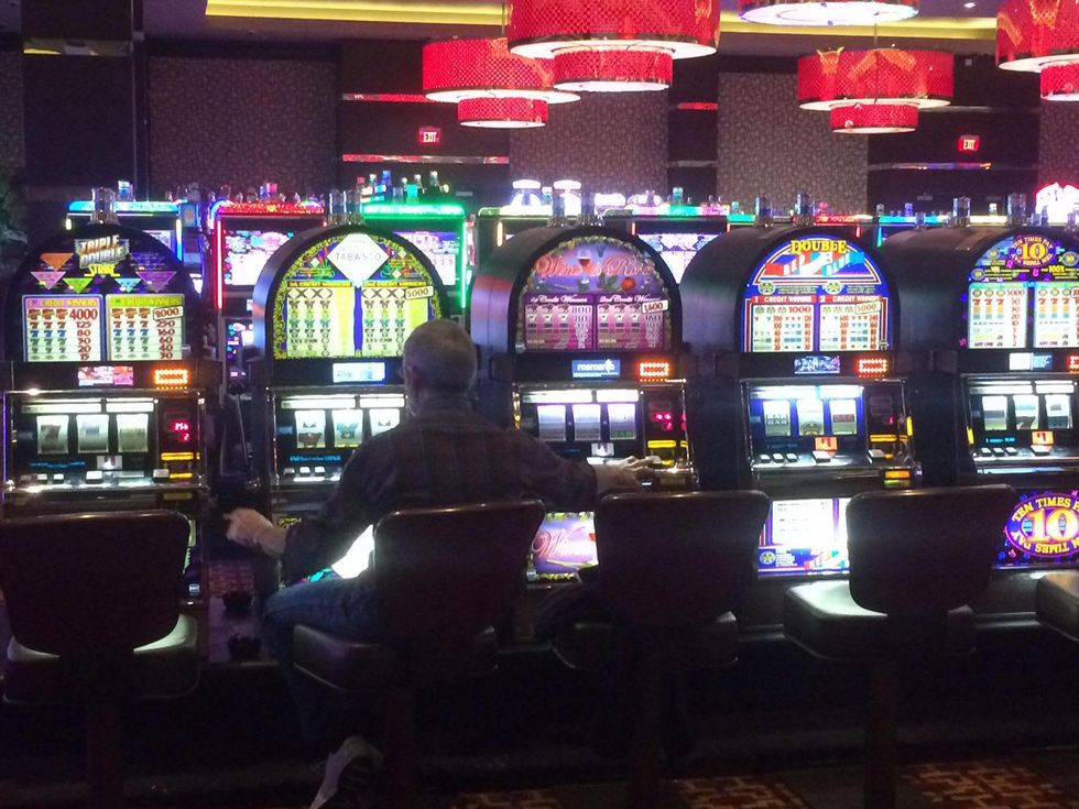 Guy plays three slot machines at Golden Nugget in Lake Charles