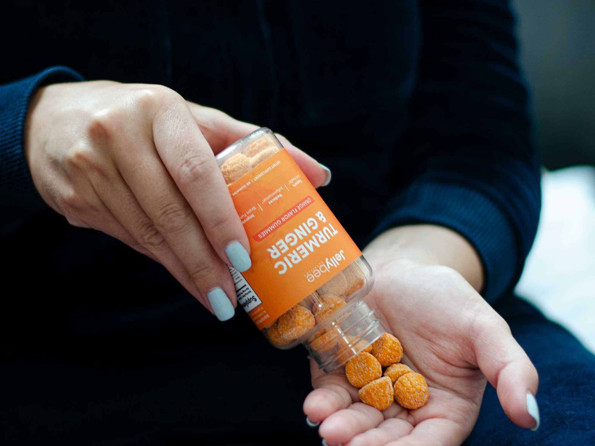 Hands holding pill bottle