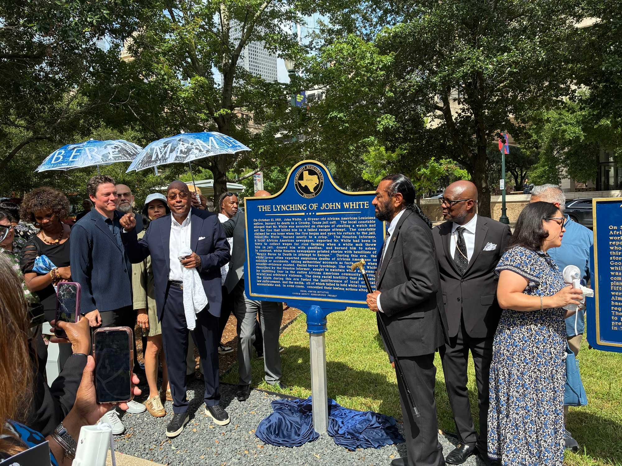Harris County Commisioner Rodney Ellis and Rep. Al Green posing in front of new historical markers for Remembrance Park.