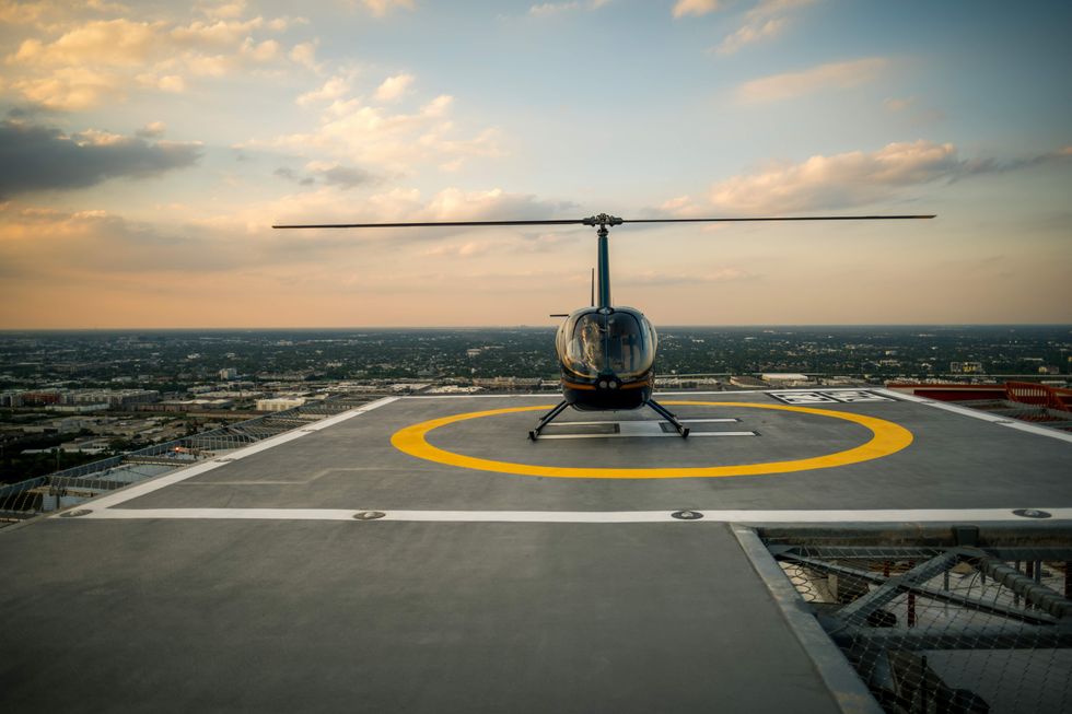 Helistop with a helicopter on it on the roof of The Residences at The Allen