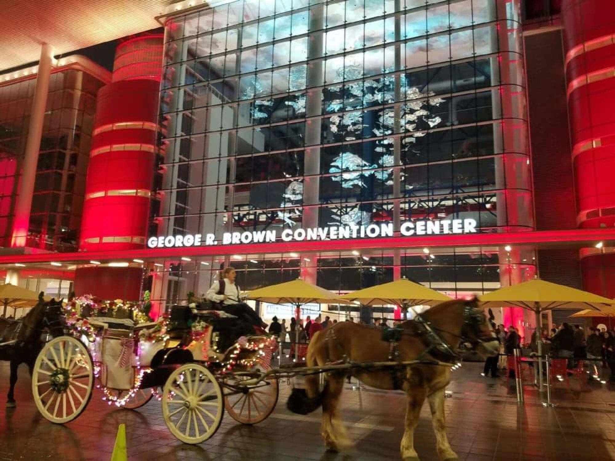 Horse drawn carriage in front of George R Brown Convention Center for Super Bowl kickoff