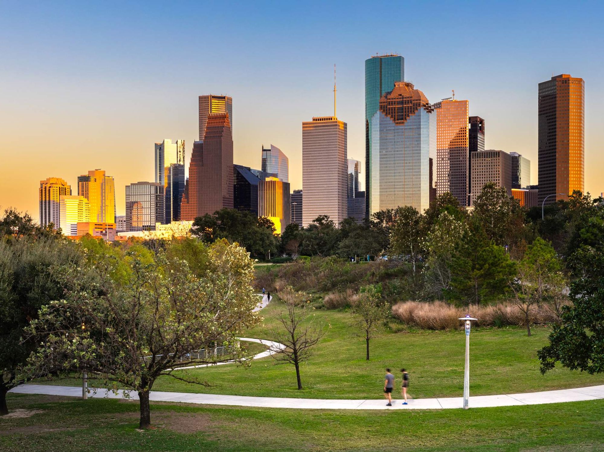 Houston Downtown modern business city with skyscraper city scape with park view from Buffalo Bayou center of Houston city, Texas, United States of America, US at sunset time