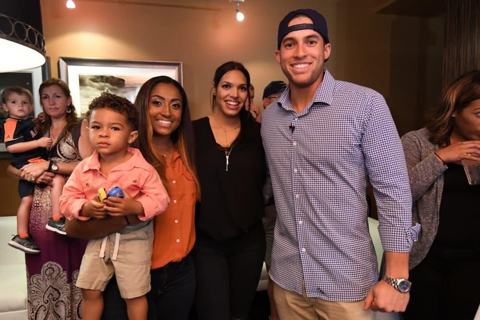 Family of George Springer. Left to right, father George Springer, Jr.,  sister Lena (holding Nicole's son, Bryce), fiancee C…