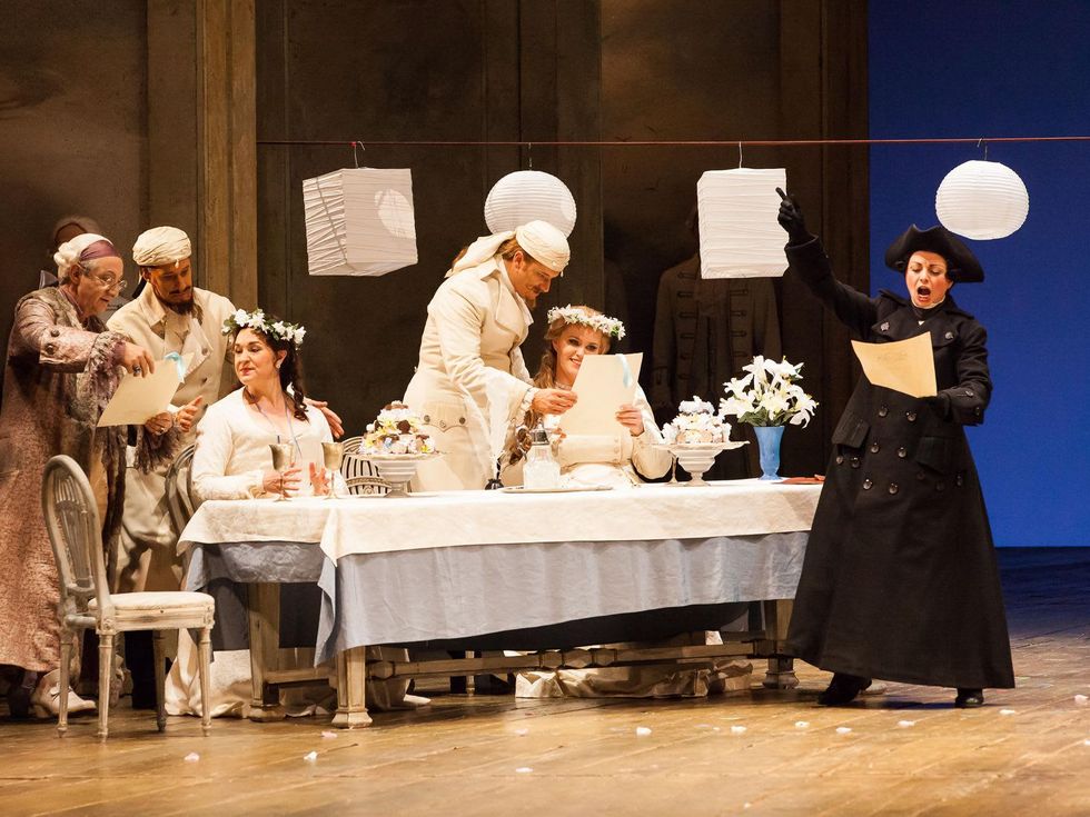 Houston Grand Opera Cosi fan tutte October 2014 Allessandro Corbelli as Don Alfronso, from left, Jacques Imbrailo as Gugielmo, Melody Moore and Dorabella, Norman Reinhardt as Ferrando, Rachel Willis-Sorensen as Fiordiligi and Nuccia Focile as Despina