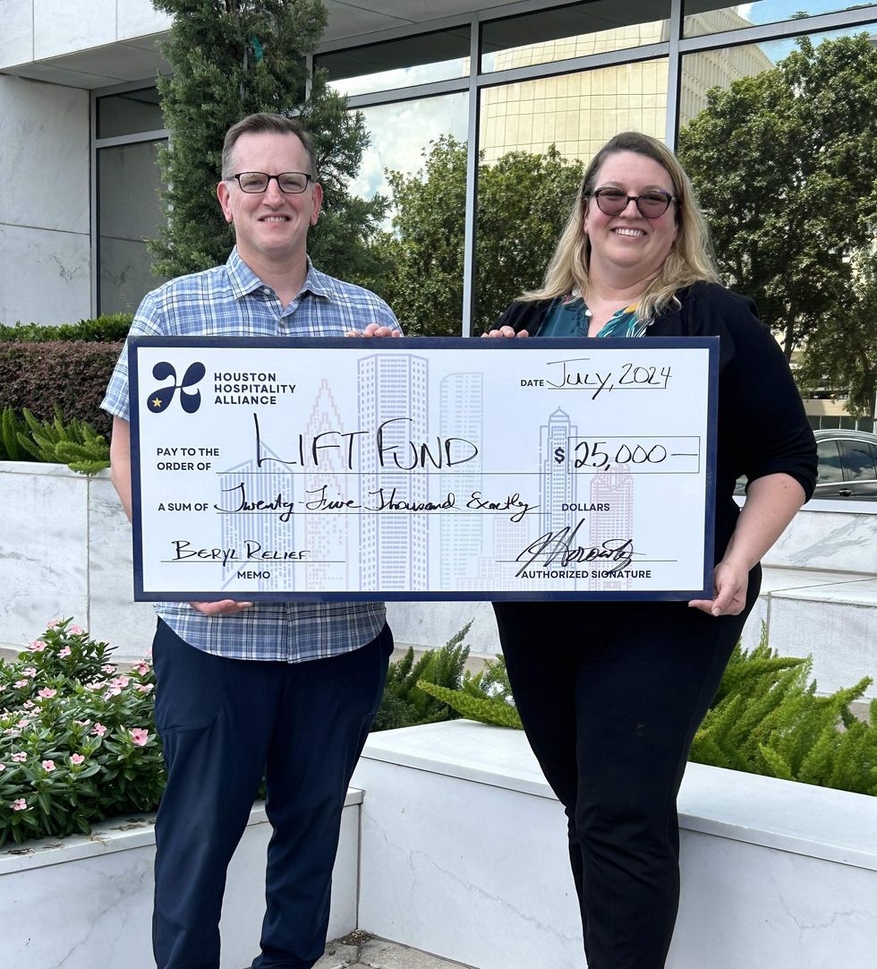 Houston Hospitality Alliance check presentation to LiftFund.