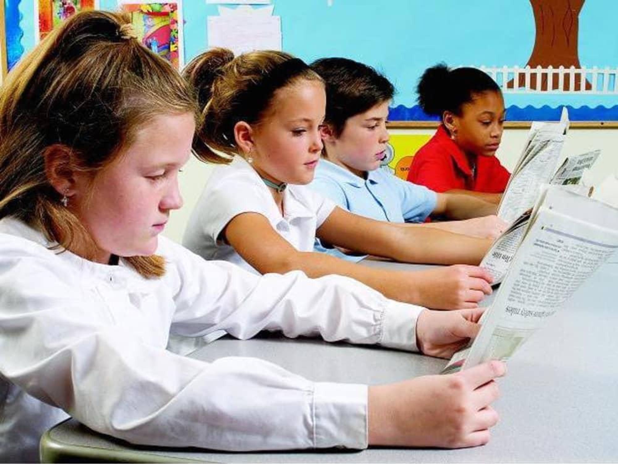 Houston, kids reading paper, August 2017